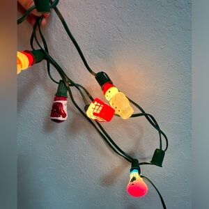 1984 Avon glass Christmas string light - character bulbs- one light doesn’t work